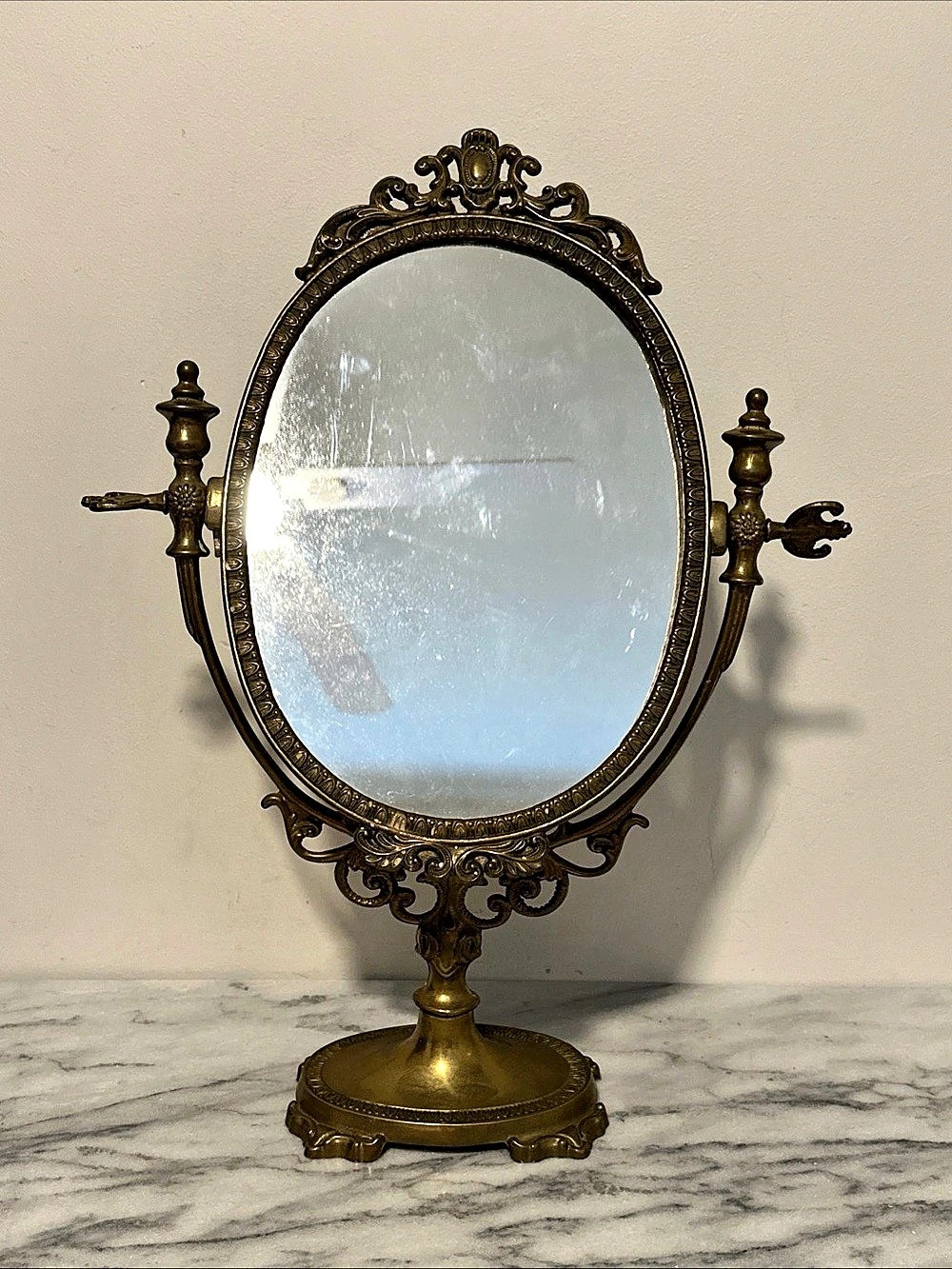 Antique French brass swivel counter top
Ornate Gold Vanity Mirror